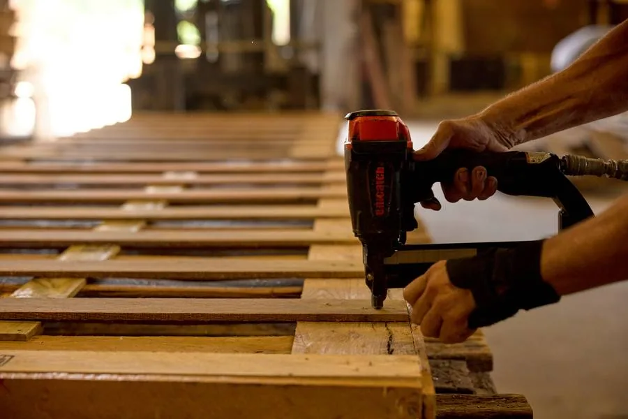 Pallet deck being nailed by hand at the Clinton shop